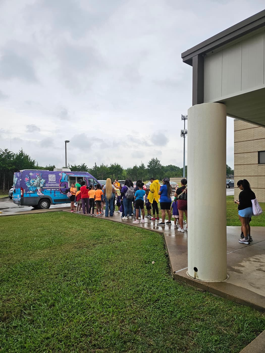 Students enjoying Iced Out Philly water ice at a school event