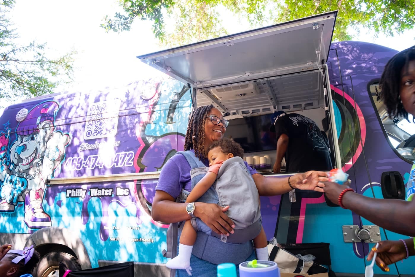 Tiffany Marshall greeting guests at the Iced Out truck window